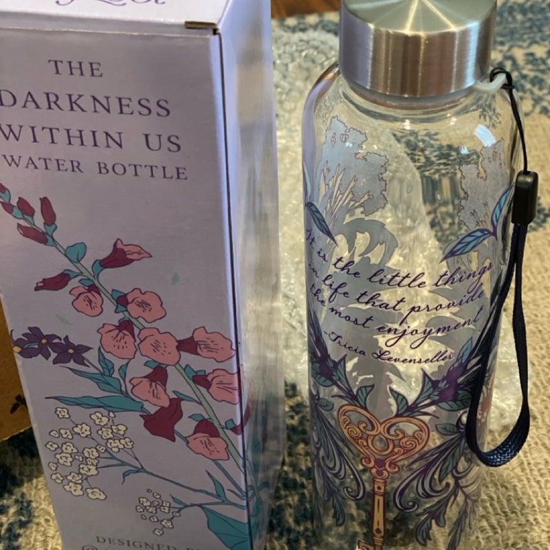 The Darkness Within Us Fairyloot book & water bottle and the First Edition book