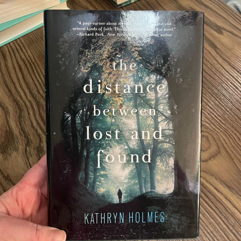 Signed! The Distance Between Lost and Found