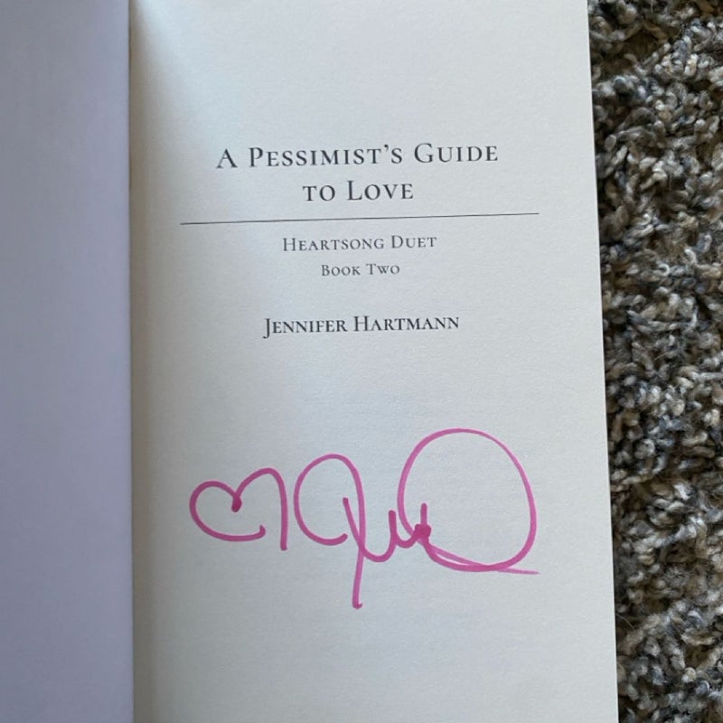 SIGNED an optimist’s guide to heartbreak & a pessimist’s to love