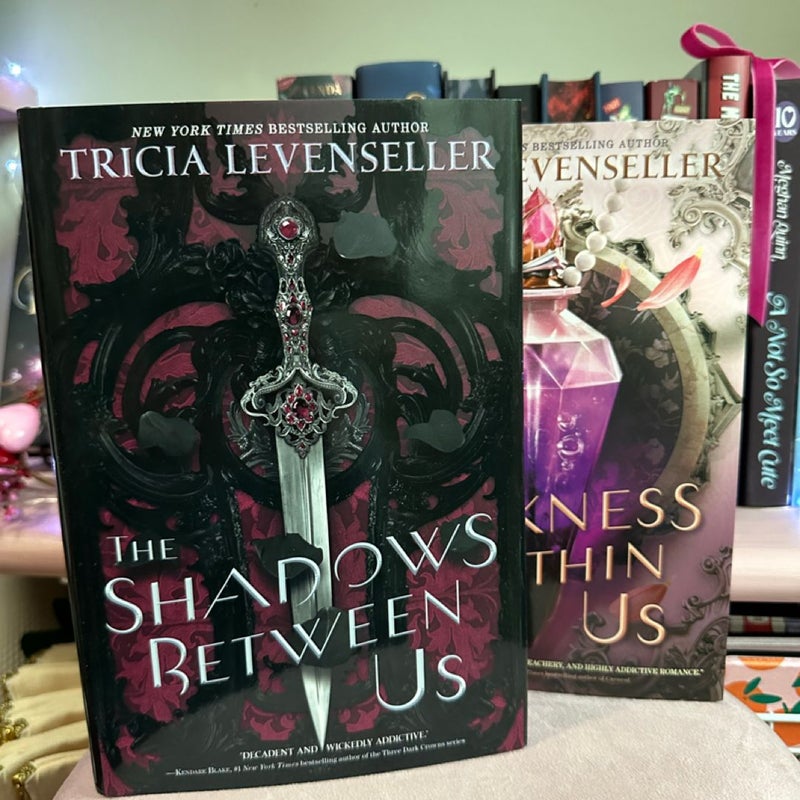 The Shadows Between Us and The Darkness Within Us by Tricia Levenseller