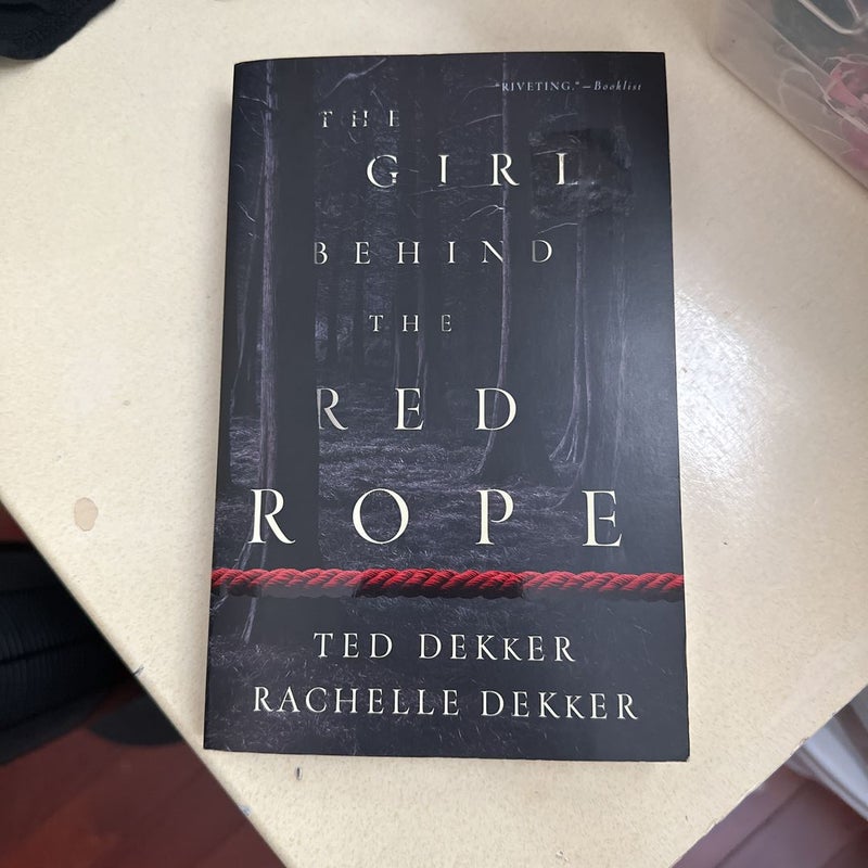 The Girl Behind the Red Rope