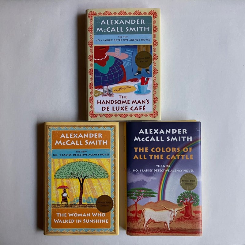 SIGNED Lot The No. 1 Ladies Detective Agency: The Handsome Man's de Luxe Café; The Woman Who Walked In Sunshine; The Colors of All The Cattle