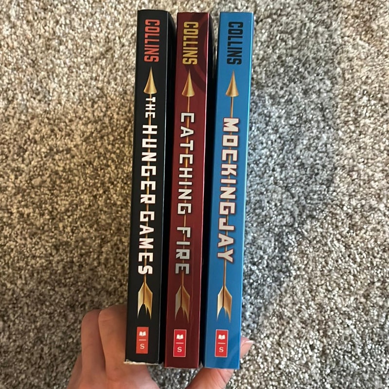 The Hunger Games, Catching Fire, and Mockingjay