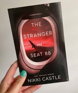 The stranger in seat 8B - signed