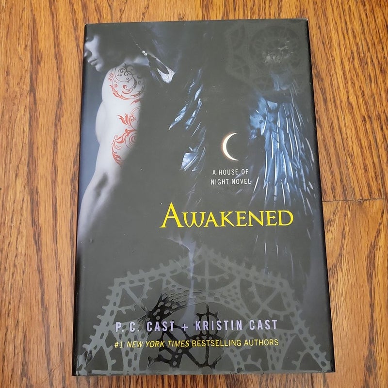Awakened (First Edition ) Reversible Dust Jacket. Design on Hardcover