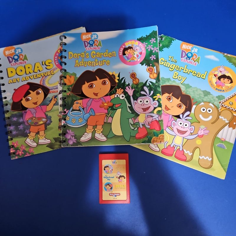 Nick Jr. Presents...DORA THE EXPLORER Story Reader Set - Includes Story Reader Device (fully operational) and three Read-Along Books, "Dora's Garden Adventure," "Dora's Art Adventure," & "The Gingerbread Boy," with their Companion Cartridge