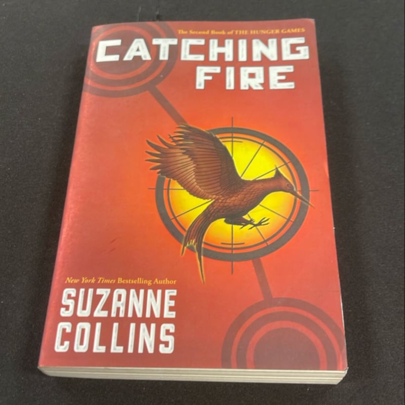Catching Fire by Suzanne Collins, Paperback | Pangobooks