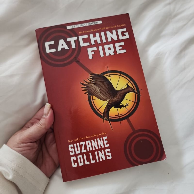 Catching Fire by Suzanne Collins, Paperback | Pangobooks