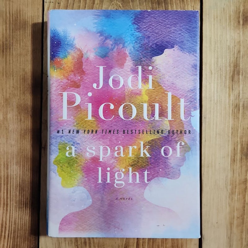 (First Edition) A Spark of Light
