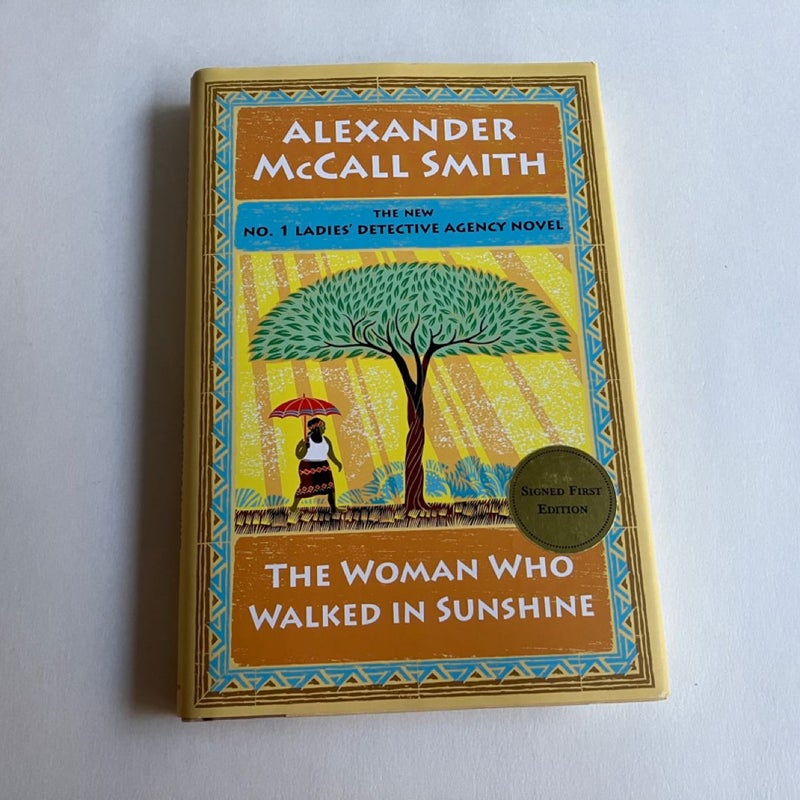 SIGNED Lot The No. 1 Ladies Detective Agency: The Handsome Man's de Luxe Café; The Woman Who Walked In Sunshine; The Colors of All The Cattle