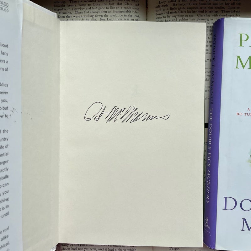 Two Autographed Patrick McManus books