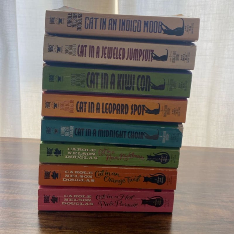 Cat in an Indigo Mood / Cat in a Jeweled Jumpsuit / Cat in a Kiwi Con / Cat in a Leopard Spot / Cat in a Midnight Choir / Cat in a Neon Nightmare / Cat in a Orange Twist / Cat in a Pink Pursuit