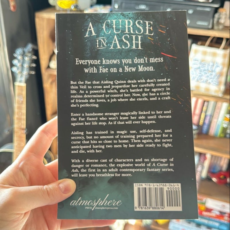 A Curse in Ash