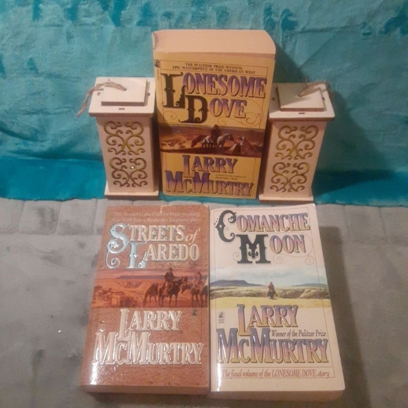 3 Lonesome Dove Series Books By Larry McMurtry, all mass market paperbacks! 
Lonesome Dove,
Streets Of Laredo -tint cover rips, 1 was taped. 
Comanche Moon - creased cover.

Books have some cover wear & spine creases. In good shape.