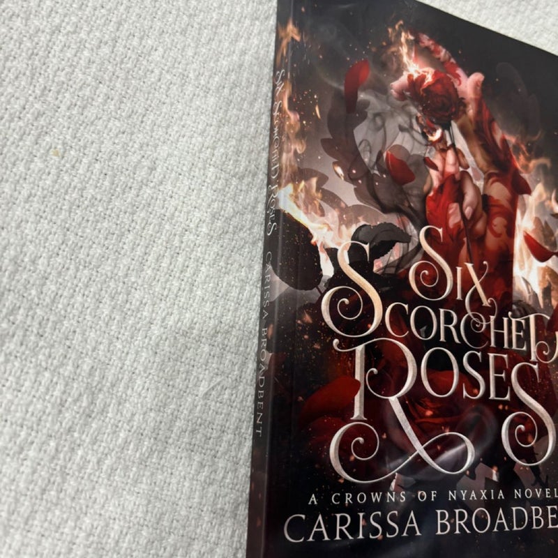 Six scorched roses