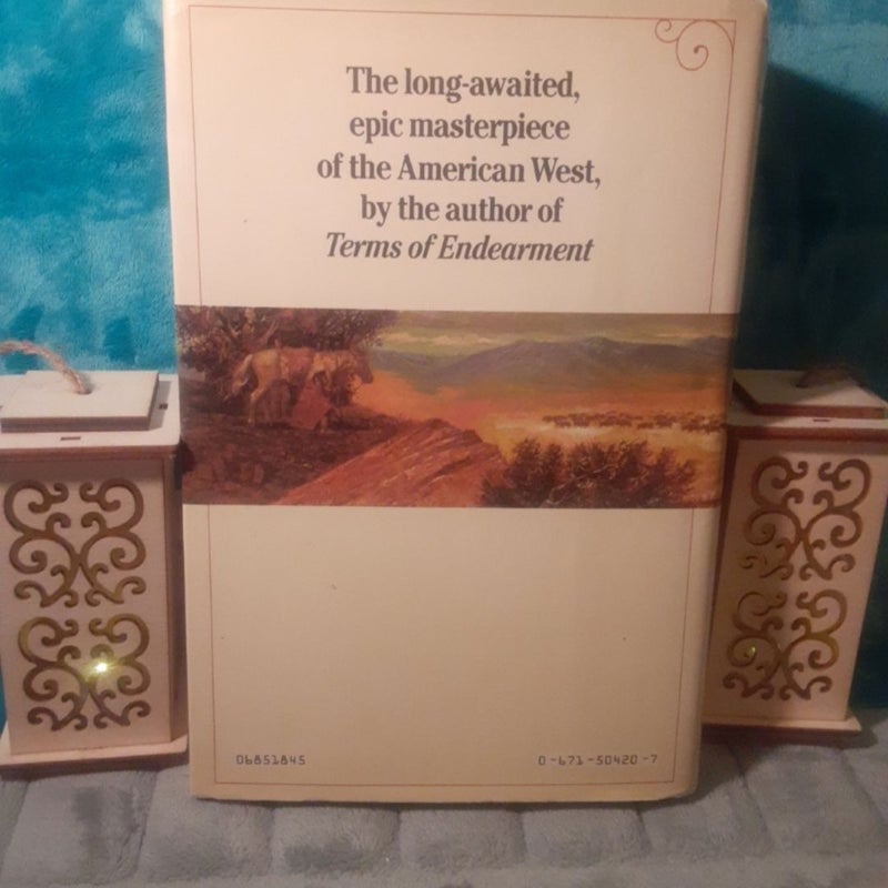 2 Hardcover Books By Larry McMurtry! Both with dust jackets. =0

~ Lonesome Dove : 2nd printing, with the page 621 typo Error! Book has some reading wear & age spots on top. In good shape.

~ Comanche Moon : 1st printing, some shelf wear & sticker remains on DJ. Pencil inscription on 1st page, in very good shape