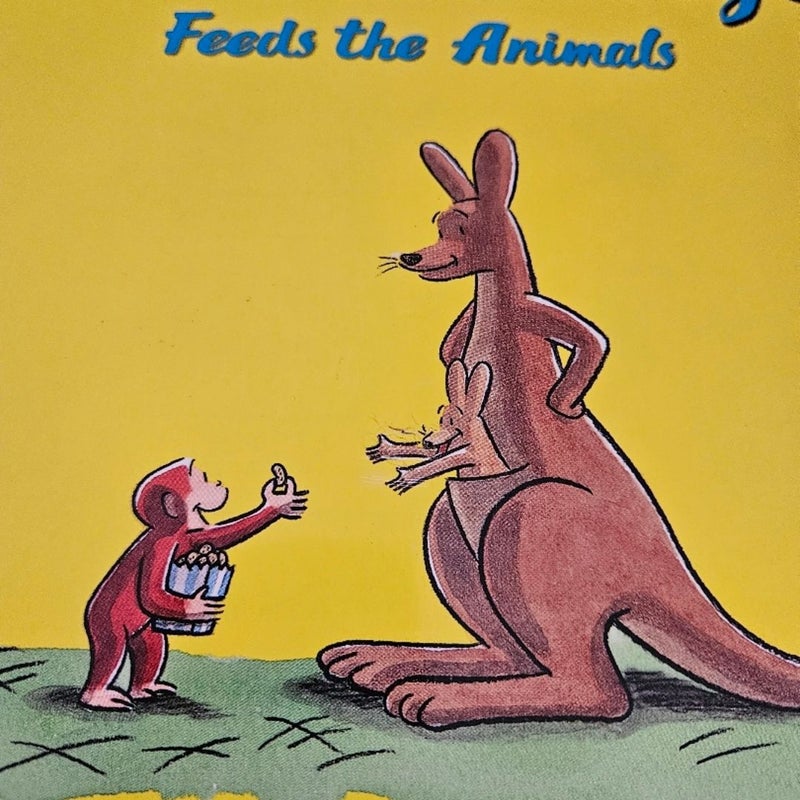 Curious George feeds the animals