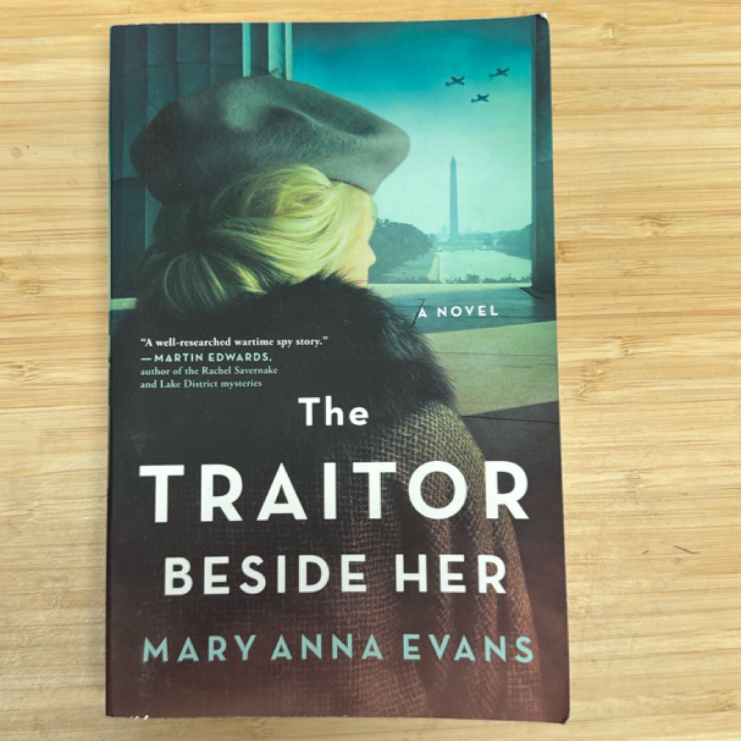 The Traitor Beside Her