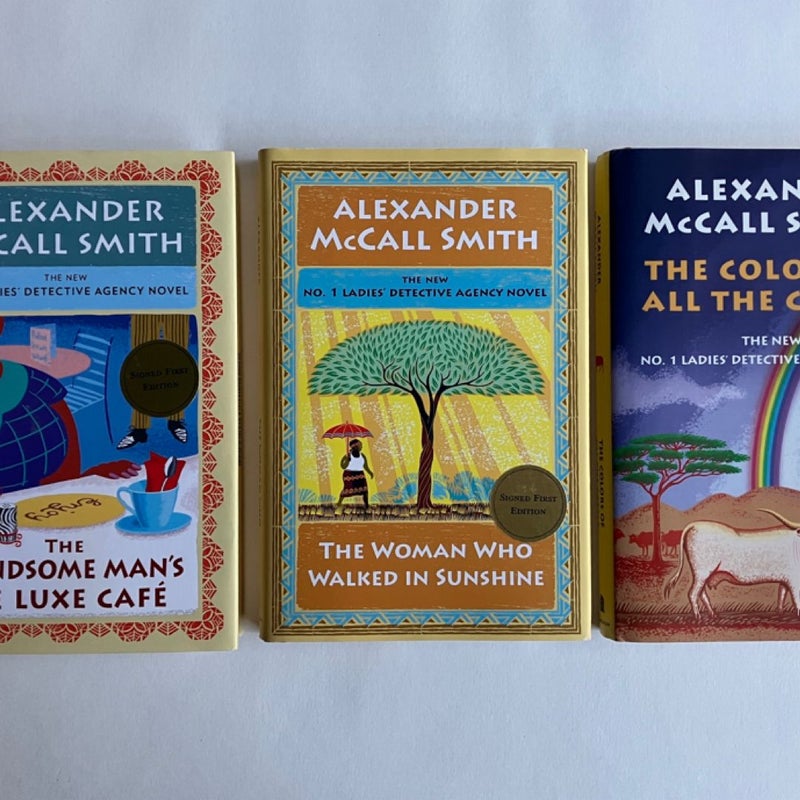 SIGNED Lot The No. 1 Ladies Detective Agency: The Handsome Man's de Luxe Café; The Woman Who Walked In Sunshine; The Colors of All The Cattle