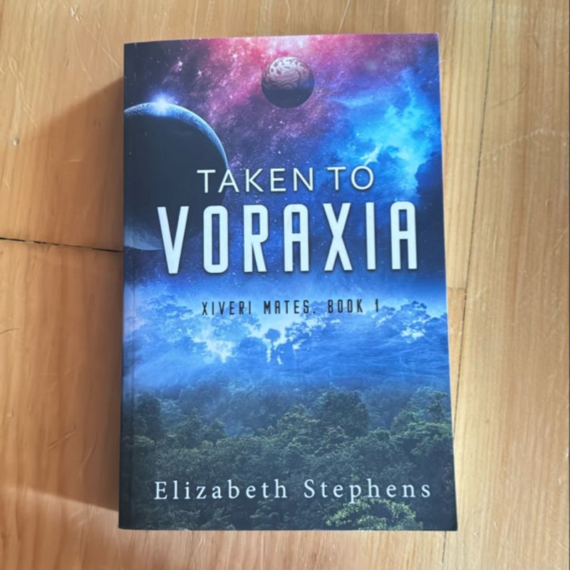 Taken to Voraxia: a SciFi Alien Romance (Xiveri Mates Book 1)
