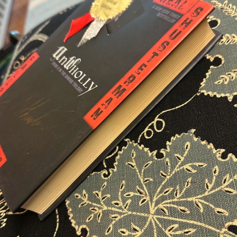 UnWholly (Numbered 464/500, Signed Special Edition)