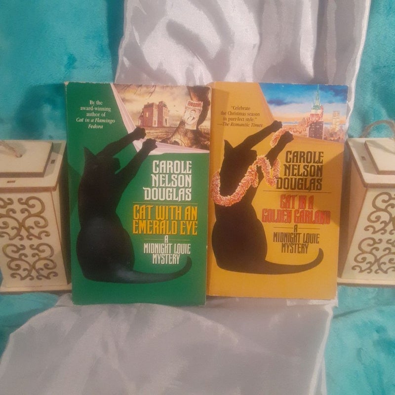 2 A Midnight Louie mystery books by Carole Nelson Douglas! Cat with an Emerald Eye, Cat in a Golden Garland
