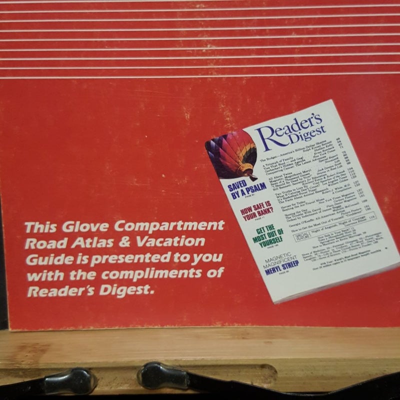 Glove compartment road atlas and vacation guide