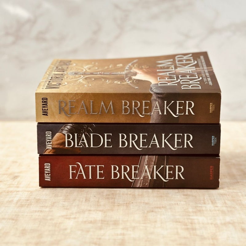 Realm Breaker trilogy with promo items