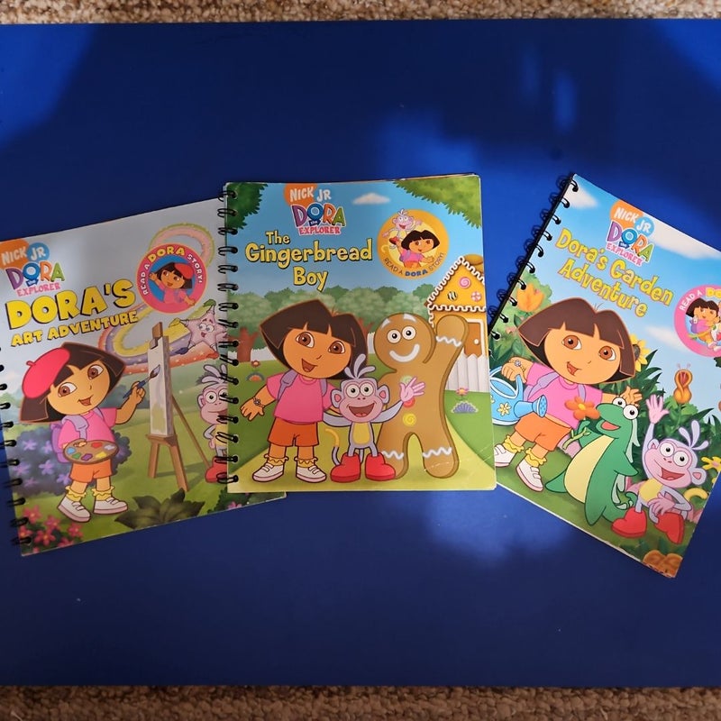 Nick Jr. Presents...DORA THE EXPLORER Story Reader Set - Includes Story Reader Device (fully operational) and three Read-Along Books, "Dora's Garden Adventure," "Dora's Art Adventure," & "The Gingerbread Boy," with their Companion Cartridge