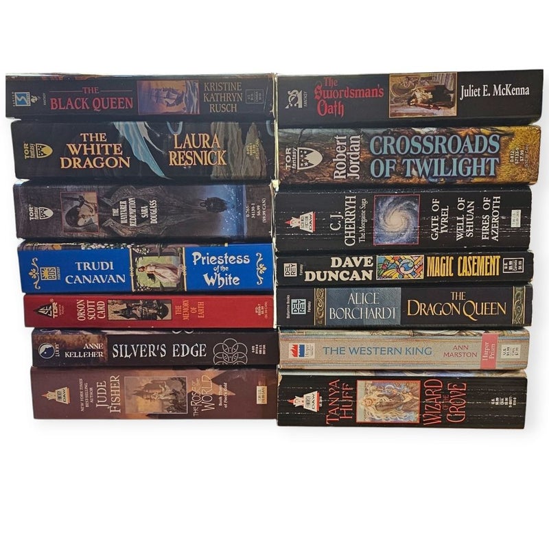 Assortment of 14 paperback fantasy novels by Jude Fisher, Laura Resnick, Robert Jordan, and C. J. Cherryh.
