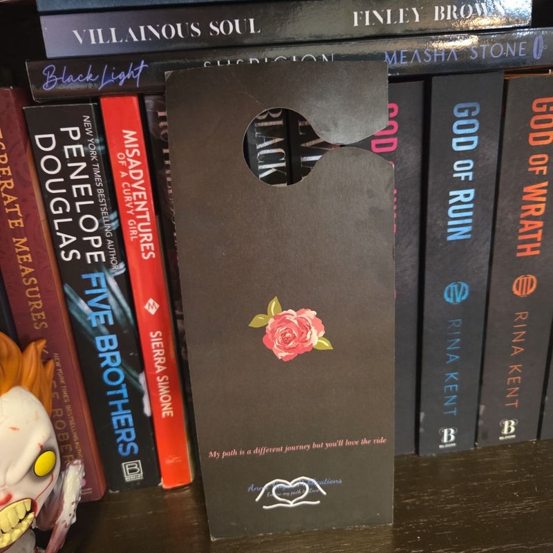 "DND I'm reading Anna Hague" door sign