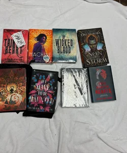 Box with 8 books and 40 goodies from Bookish box, Illumicrate, Fairyloot, Faecrate and Owlcrate. 