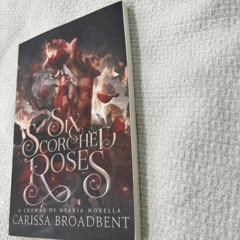 Six scorched roses