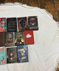 Box with 11 books and 29 goodies from Bookish box, Illumicrate, Fairyloot, Faecrate and Owlcrate.