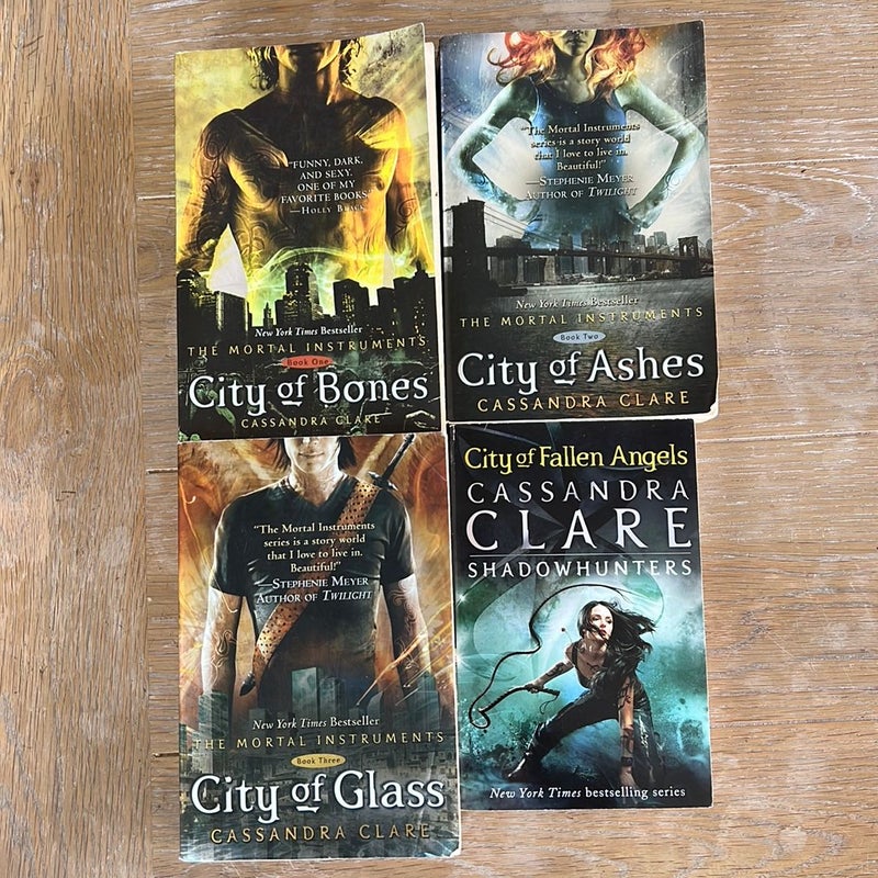 The Mortal Instuments books 1-4. City of bones. City of ashes. City of glass. City of fallen angels