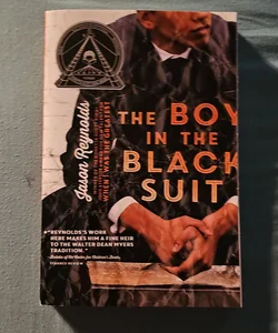 The Boy in the Black Suit*