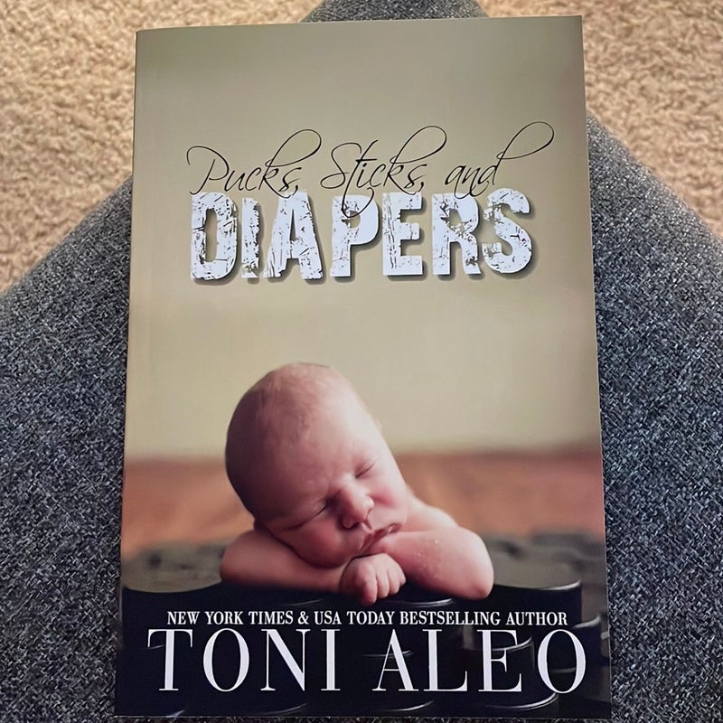 Pucks, Sticks, and Diapers (signed by the author)