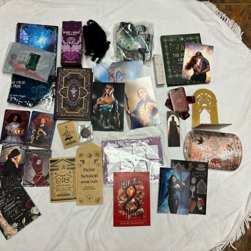 Box with 11 books and 29 goodies from Bookish box, Illumicrate, Fairyloot, Faecrate and Owlcrate.