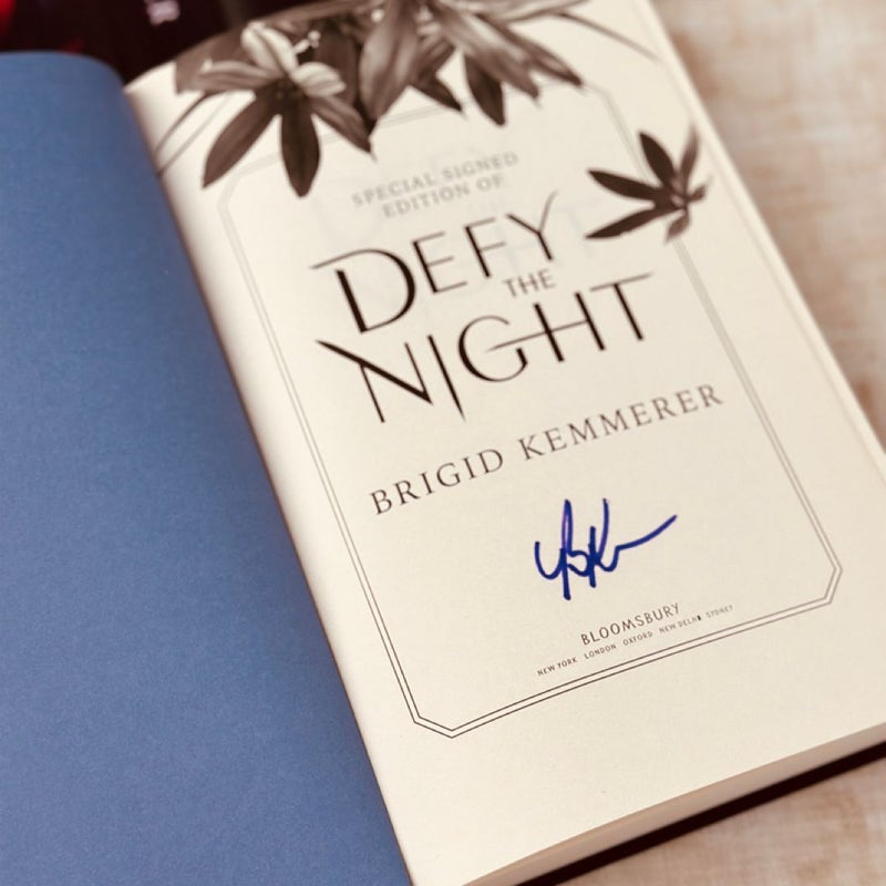 Signed Defy the Night with reversed dust jacket