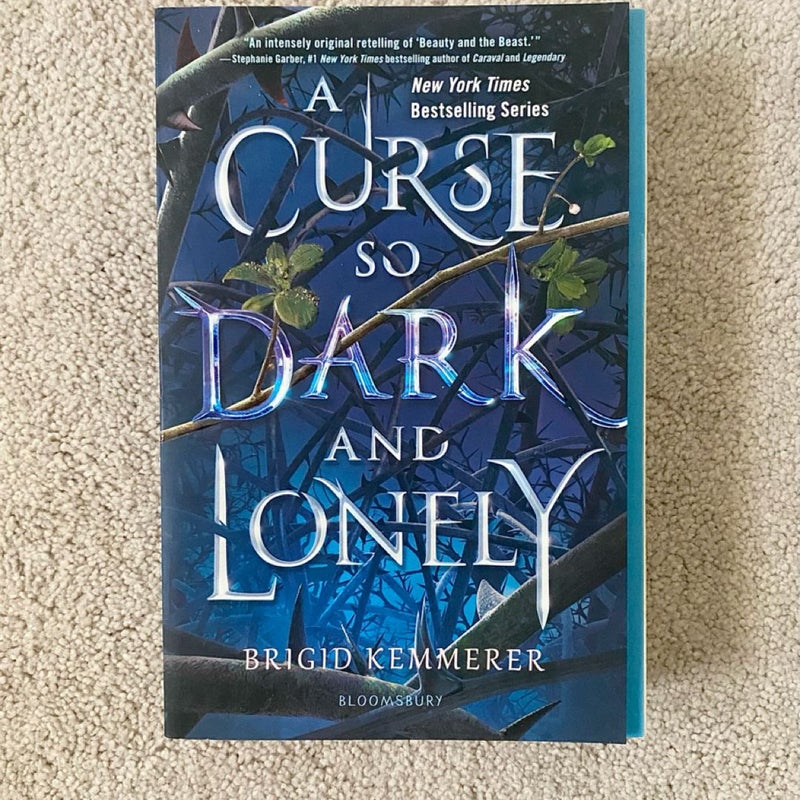 A Curse So Dark and Lonely paperback