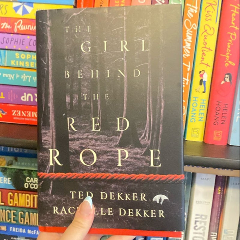 The girl behind the red rope 